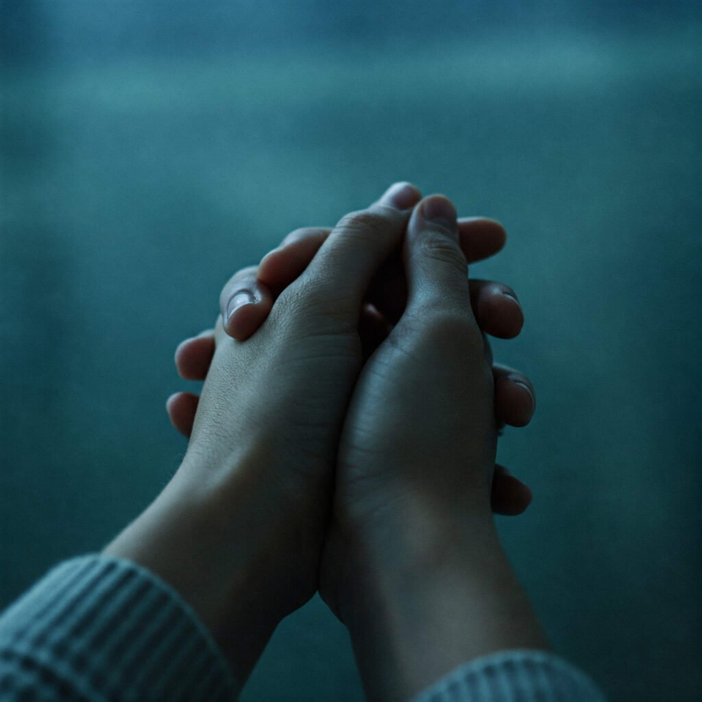 Hands clasped in peaceful prayer