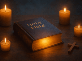 A glowing Bible on a wooden table