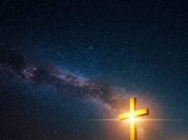 Starry sky with glowing cross.