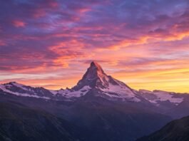 Glowing sunrise over mountain, inspiring.