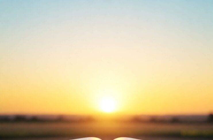 Open Bible with sunrise background