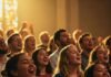 Goodness of God Lyrics Breakdown: A Song of Hope and Faith Congregation singing in worship.